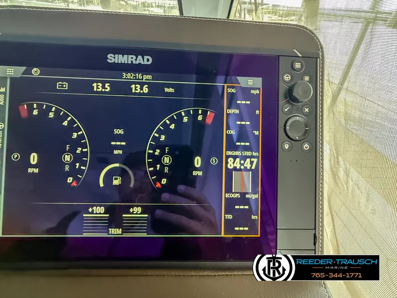 Slide: The Image of Simrad display on 2021 Four Winns Vista 355 Coupe OB, showing engine and navigation data. - 13