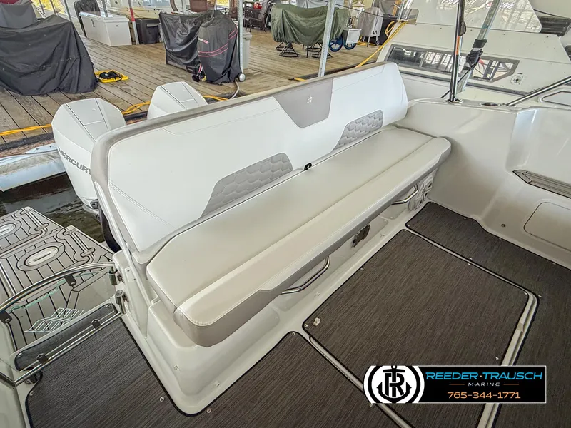 Slide: The Image of 2021 Four Winns Vista 355 Coupe OB interior seating area with modern design and comfortable upholstery. - 32