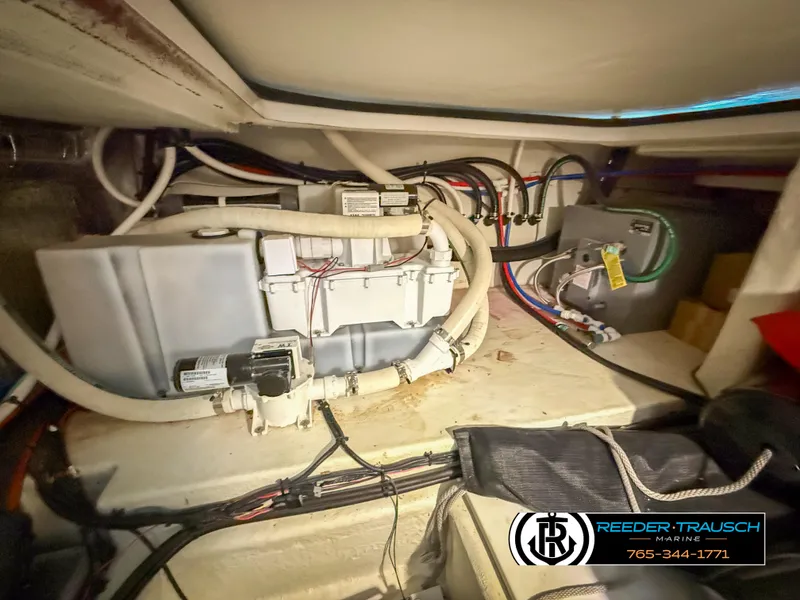 Slide: The Image of Engine compartment of a 2021 Four Winns Vista 355 Coupe OB boat, showing wiring and components. - 37