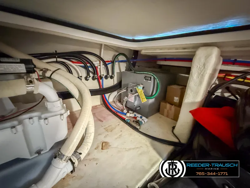 Slide: The Image of Engine compartment of 2021 Four Winns Vista 355 Coupe OB with visible hoses and equipment. - 39