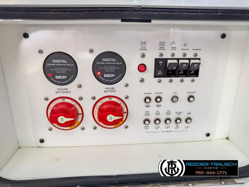 Slide: The Image of Control panel of 2021 Four Winns Vista 355 Coupe OB boat with switches and gauges. - 40