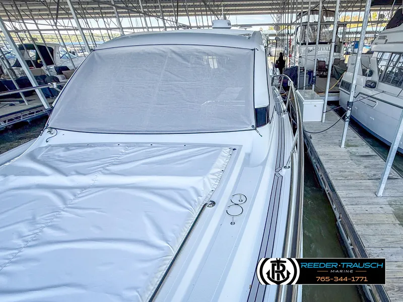 Slide: The Image of 2021 Four Winns Vista 355 Coupe OB docked, covered, in a marina. - 5