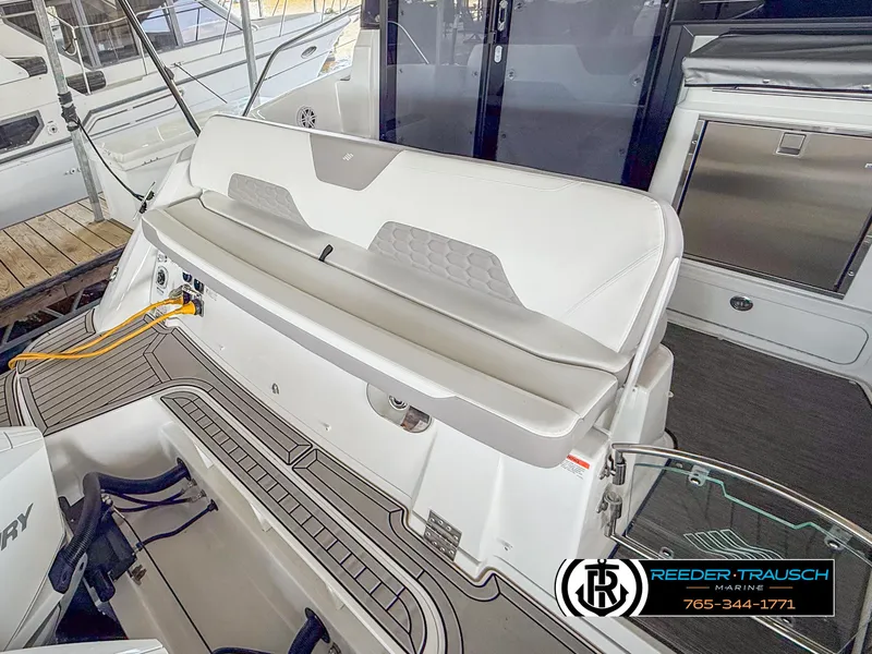 Slide: The Image of 2021 Four Winns Vista 355 Coupe OB boat interior with seating and deck details. - 6