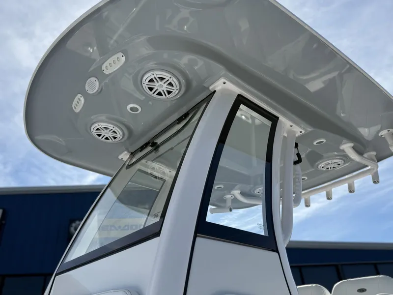 Slide: The Image of 2025 Sportsman Open 212 Center Console with speakers and roof view. - 18