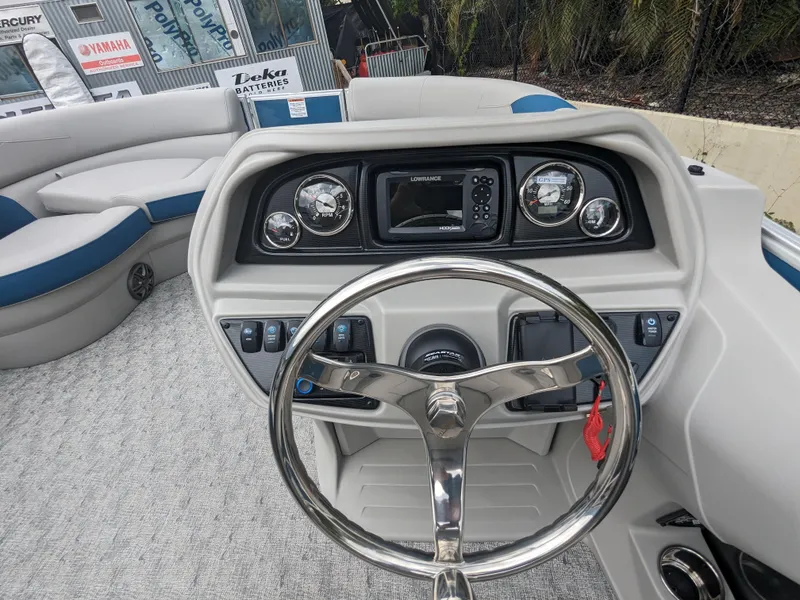 Slide: The Image of 2024 Trifecta 22TRFC LE 2.75 boat dashboard with steering wheel and gauges. - 17