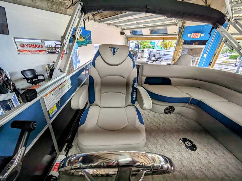 Slide: The Image of 2024 Trifecta 22TRFC LE 2.75 boat interior with plush seating and modern design. - 20