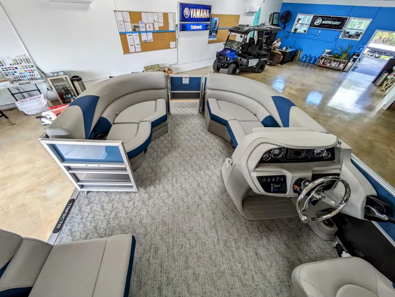 Slide: The Image of 2024 Trifecta 22TRFC LE 2.75 pontoon boat interior with plush seating and modern dashboard. - 21