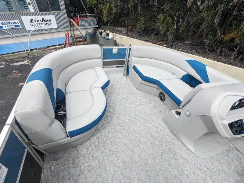 Slide: The Image of 2024 Trifecta 22TRFC LE 2.75 pontoon boat interior with plush seating and modern design. - 23