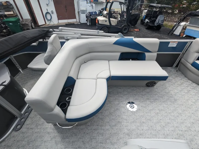 Slide: The Image of 2024 Trifecta 22TRFC LE 2.75 pontoon boat interior with gray and blue seating. - 25