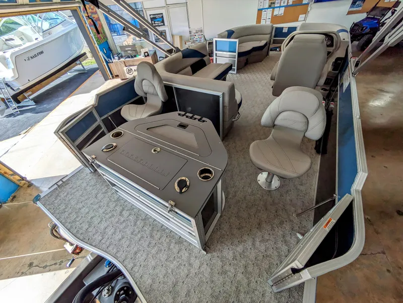Slide: The Image of 2024 Trifecta 22TRFC LE 2.75 pontoon boat interior with seating and helm. - 28