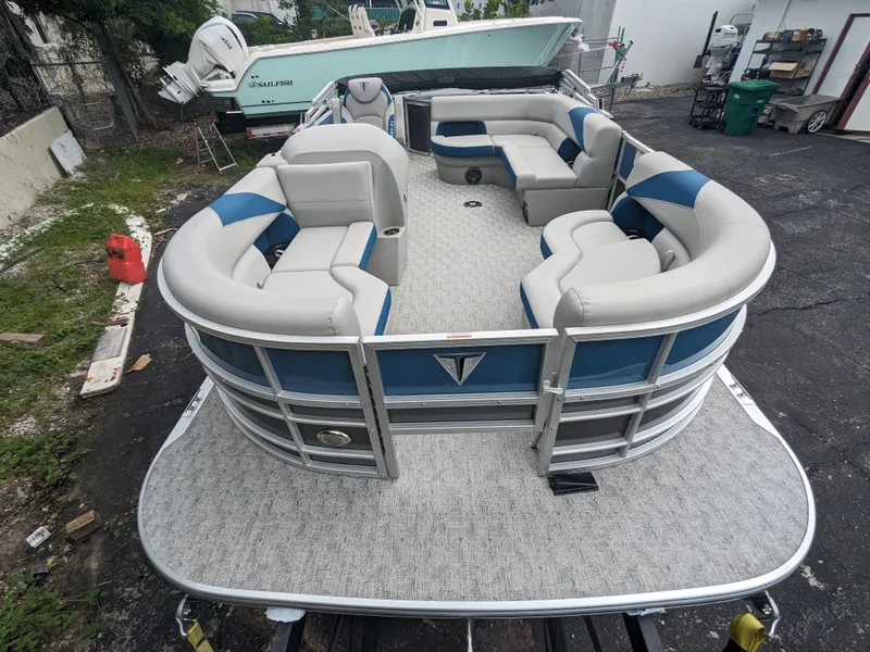 Slide: The Image of 2024 Trifecta 22TRFC LE 2.75 pontoon boat with spacious seating and modern design. - 3