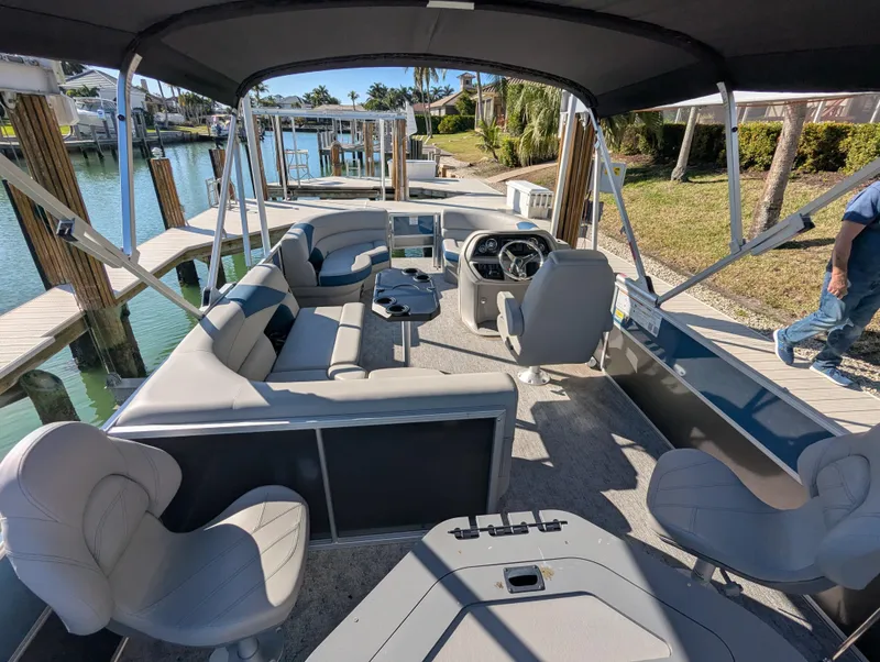 Slide: The Image of 2024 Trifecta 22TRFC LE 2.75 pontoon boat with spacious seating and modern design. - 30