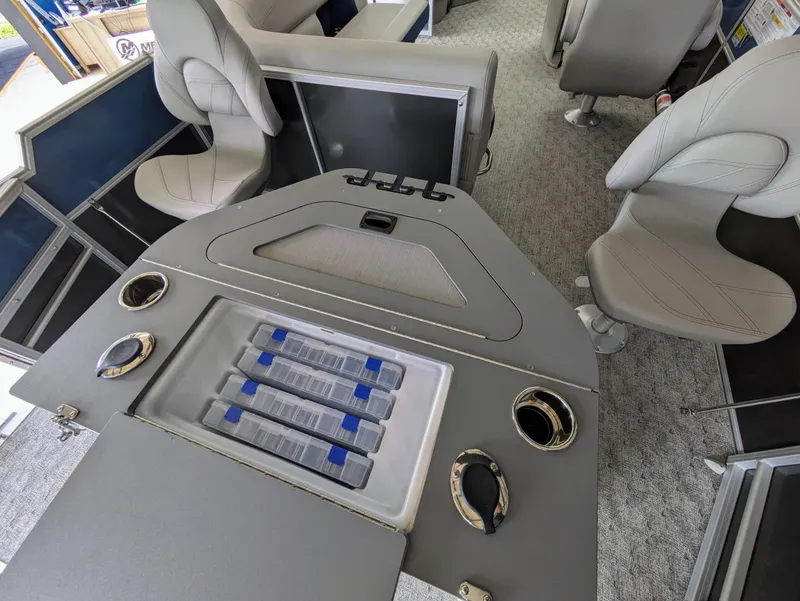 Slide: The Image of 2024 Trifecta 22TRFC LE 2.75 boat interior with seating and storage compartments. - 32