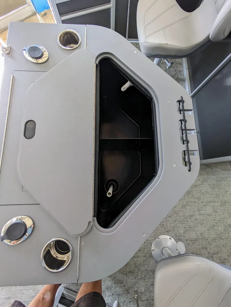 Slide: The Image of 2024 Trifecta 22TRFC LE 2.75 boat interior with open storage compartment. - 33