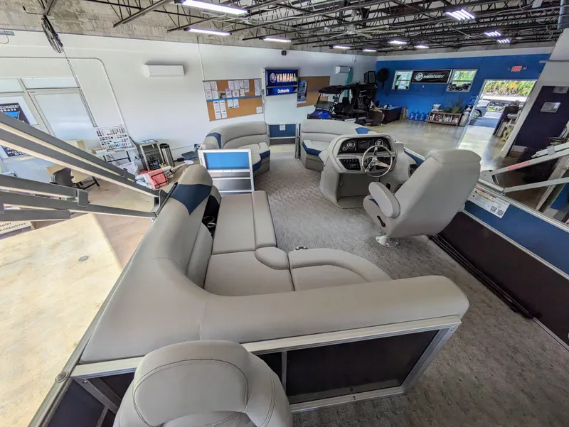 Slide: The Image of 2024 Trifecta 22TRFC LE 2.75 pontoon boat interior with plush seating and modern helm. - 34