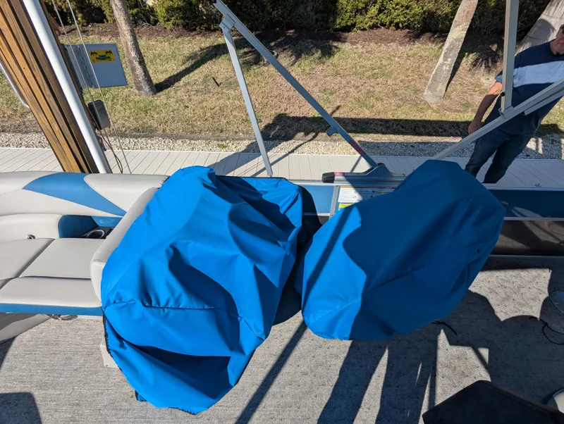 Slide: The Image of 2024 Trifecta 22TRFC LE 2.75 boat interior with blue seat covers. - 36