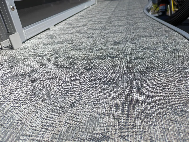 Slide: The Image of 2024 Trifecta 22TRFC LE 2.75 boat deck with textured gray flooring. - 37