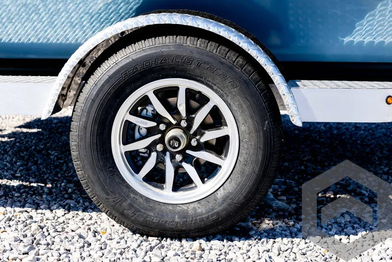 Slide: The Image of Trailer wheel of 2025 G3 Bay 21 GX on gravel surface. - 13