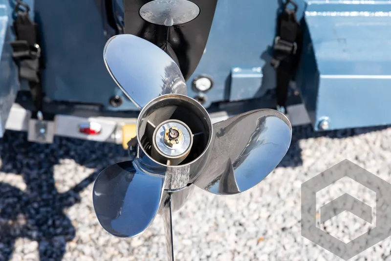 Slide: The Image of Propeller of 2025 G3 Bay 21 GX boat on gravel surface. - 16