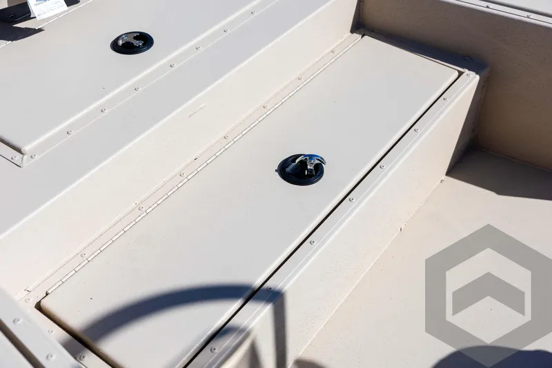 Slide: The Image of 2025 G3 Bay 21 GX boat storage compartment with secure latch. - 32