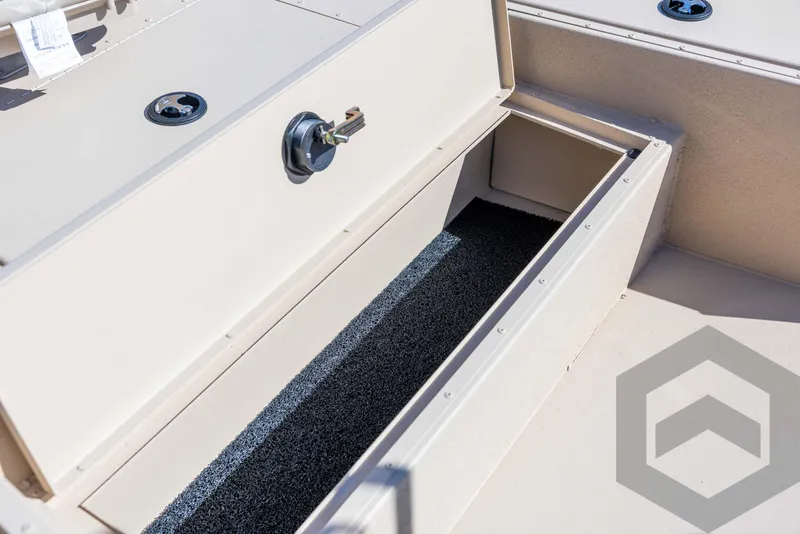 Slide: The Image of 2025 G3 Bay 21 GX boat storage compartment with open lid, showcasing interior space. - 33