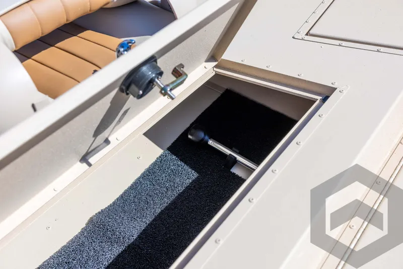 Slide: The Image of Storage compartment in 2025 G3 Bay 21 GX boat, featuring cushioned seating and hydraulic lift. - 34