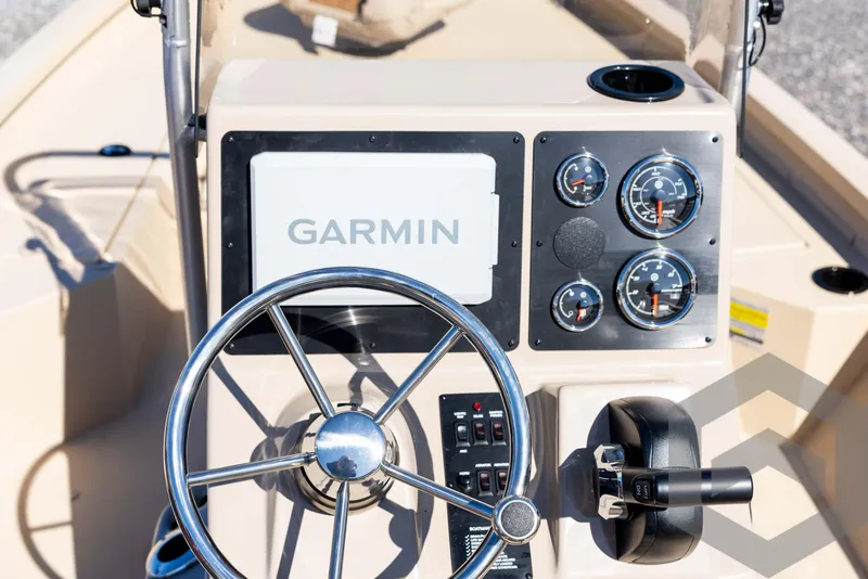 Slide: The Image of 2025 G3 Bay 21 GX boat dashboard with Garmin display and gauges. - 42