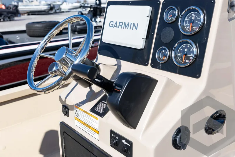 Slide: The Image of 2025 G3 Bay 21 GX boat dashboard with Garmin navigation and control gauges. - 45