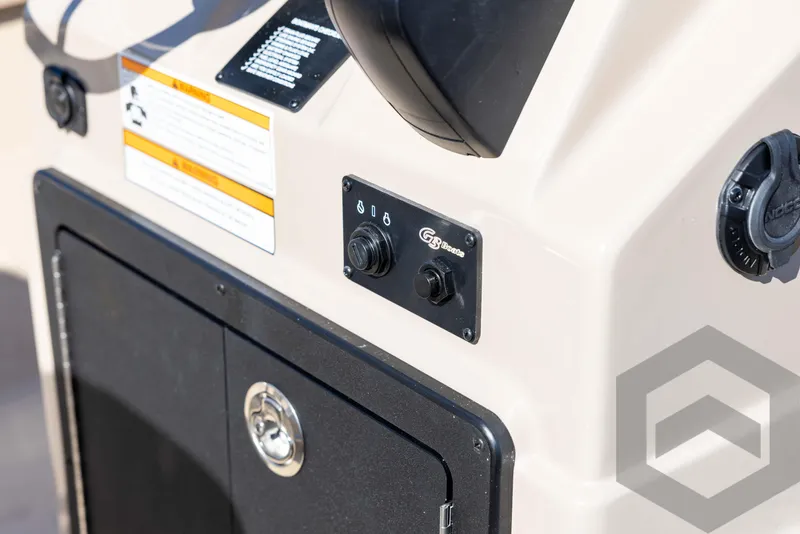 Slide: The Image of Control panel of 2025 G3 Bay 21 GX boat, featuring switches and storage compartment. - 46