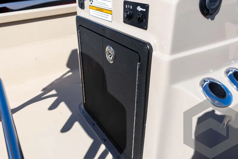 Slide: The Image of 2025 G3 Bay 21 GX boat console with storage compartment and controls. - 47