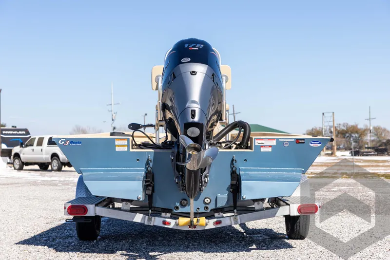Slide: The Image of 2025 G3 Bay 21 GX boat on trailer, rear view, outdoors. - 6