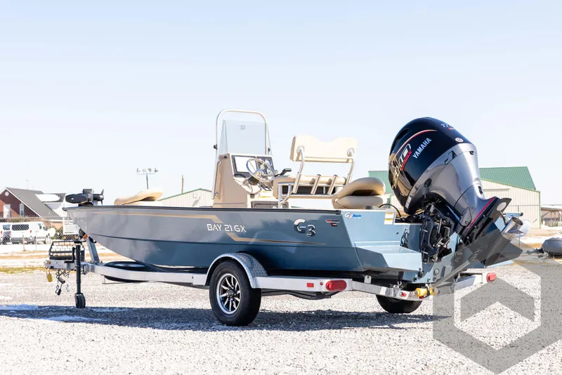 Slide: The Image of 2025 G3 Bay 21 GX boat on trailer with Yamaha outboard motor. - 7