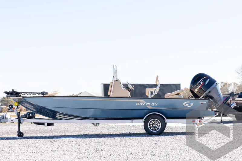 Slide: The Image of 2025 G3 Bay 21 GX boat on trailer, side view, outdoors. - 8