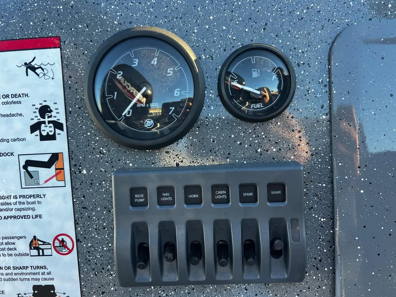 Slide: The Image of Dashboard of 2025 Thunder Jet 209 Rush OT with gauges and switches. - 12