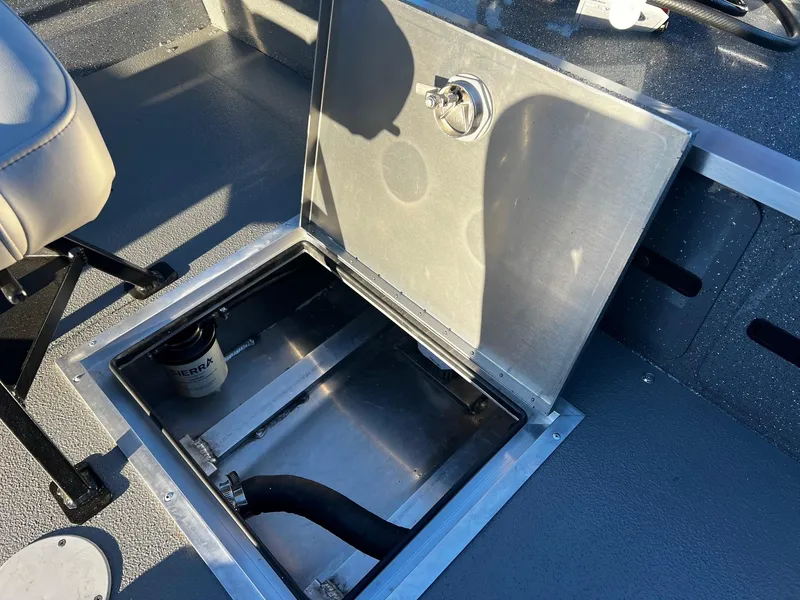 Slide: The Image of 2025 Thunder Jet 209 Rush OT boat storage compartment with open hatch and visible components. - 14