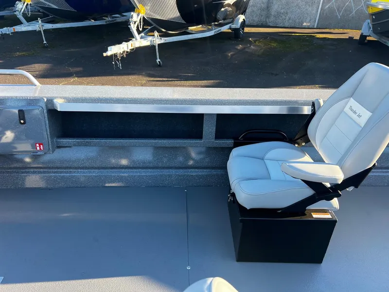 Slide: The Image of 2025 Thunder Jet 209 Rush OT boat interior with seating and storage. - 19
