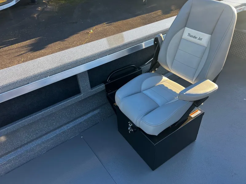Slide: The Image of Captain's seat in 2025 Thunder Jet 209 Rush OT boat, featuring cushioned design and sturdy base. - 20
