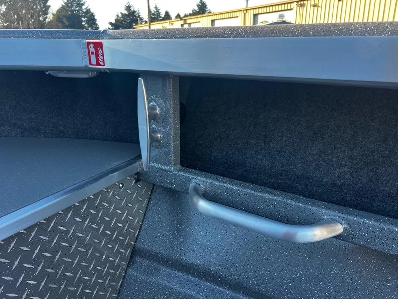 Slide: The Image of 2025 Thunder Jet 209 Rush OT interior detail with storage compartment and handle. - 24