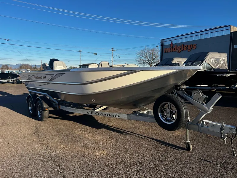 Slide: The Image of 2025 Thunder Jet 209 Rush OT boat on trailer, parked outdoors. - 3