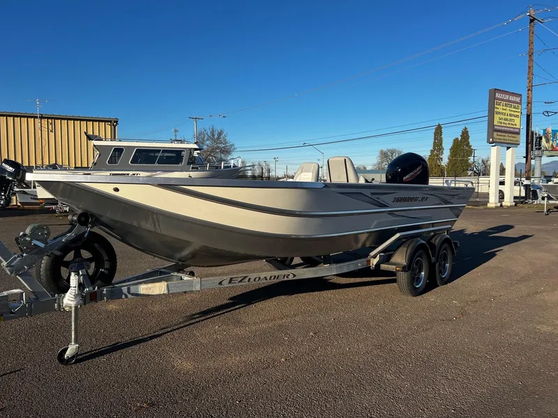 Slide: The Image of 2025 Thunder Jet 209 Rush OT boat on trailer in outdoor lot. - 4
