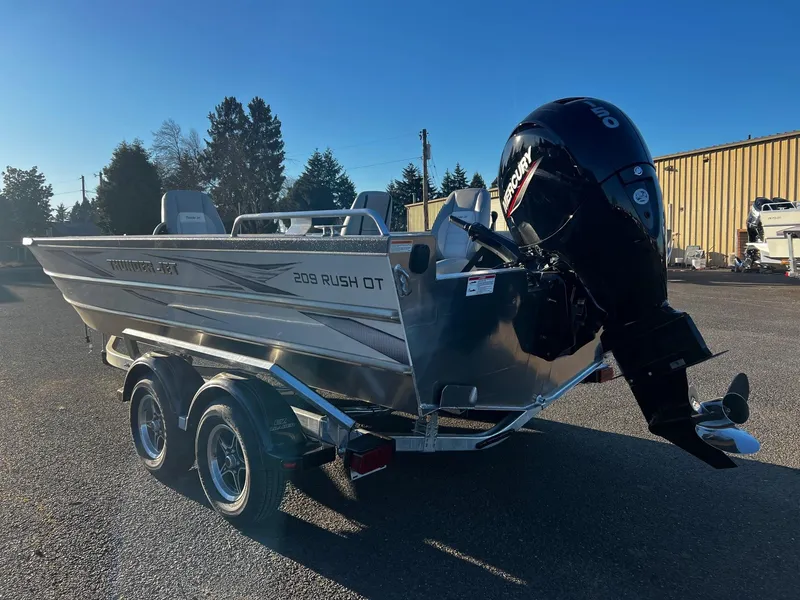 Slide: The Image of 2025 Thunder Jet 209 Rush OT boat with outboard motor on a trailer. - 7