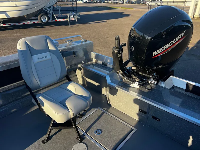 Slide: The Image of 2025 Thunder Jet 209 Rush OT boat interior with Mercury engine and seating. - 8