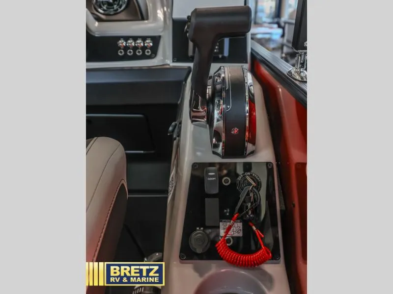 Slide: The Image of Control panel of 2025 Cabrio Ultra-Lounge 22UC boat, featuring throttle and switches. - 17