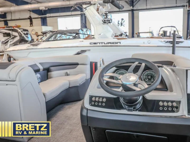 Slide: The Image of 2025 Cabrio Ultra-Lounge 22UC boat interior with steering wheel and seating at Bretz RV & Marine. - 18