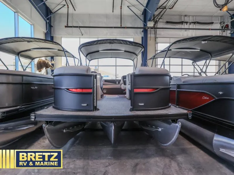 Slide: The Image of 2025 Cabrio Ultra-Lounge 22UC pontoon boat displayed at Bretz RV & Marine showroom. - 3