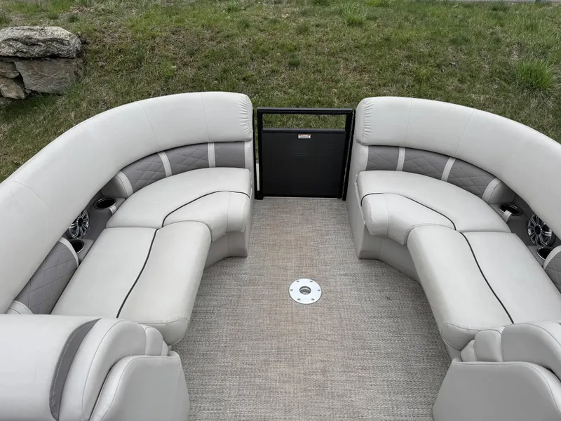 Slide: The Image of 2017 Bennington 226 GSR boat interior with plush seating and carpeted floor. - 10