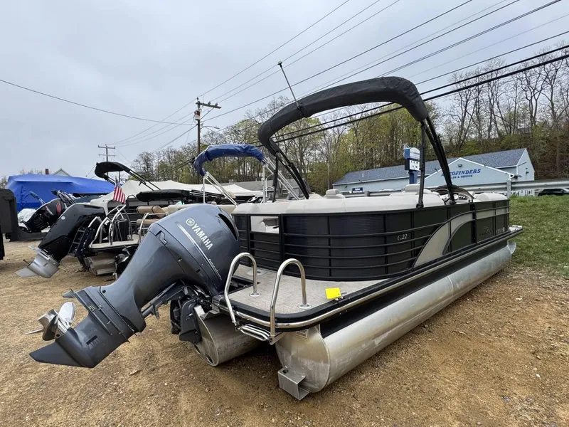 Slide: The Image of 2017 Bennington 226 GSR pontoon boat with Yamaha outboard motor, parked outdoors. - 2