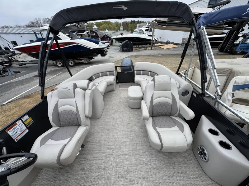 Slide: The Image of 2017 Bennington 226 GSR pontoon boat with plush seating and spacious interior. - 4