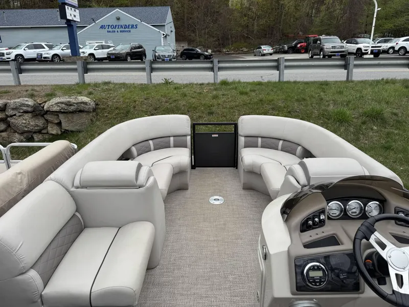 Slide: The Image of 2017 Bennington 226 GSR pontoon boat interior with plush seating and modern dashboard. - 6