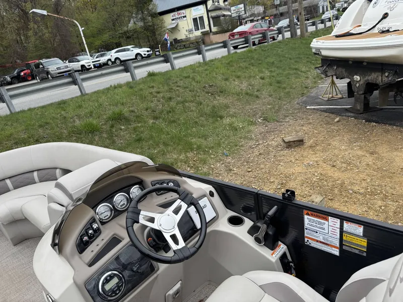 Slide: The Image of 2017 Bennington 226 GSR boat interior with steering wheel and dashboard controls. - 7